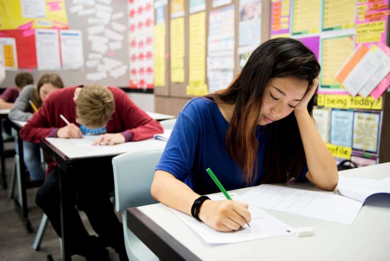 students doing the exam in classroom